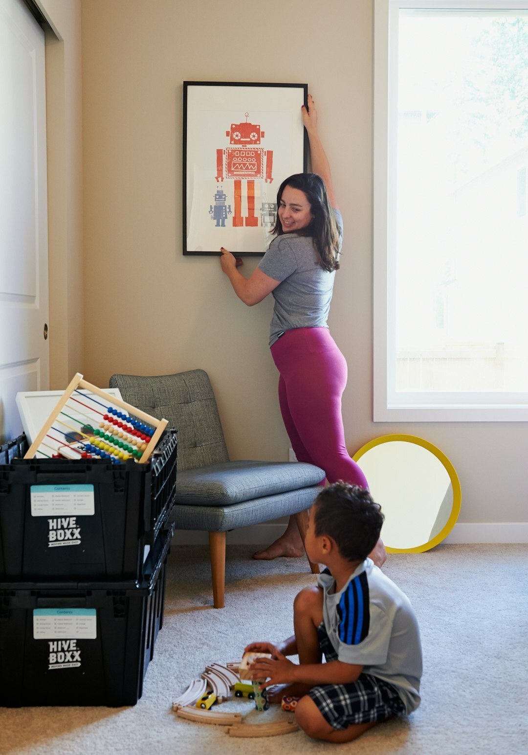 family moving boxes into new home