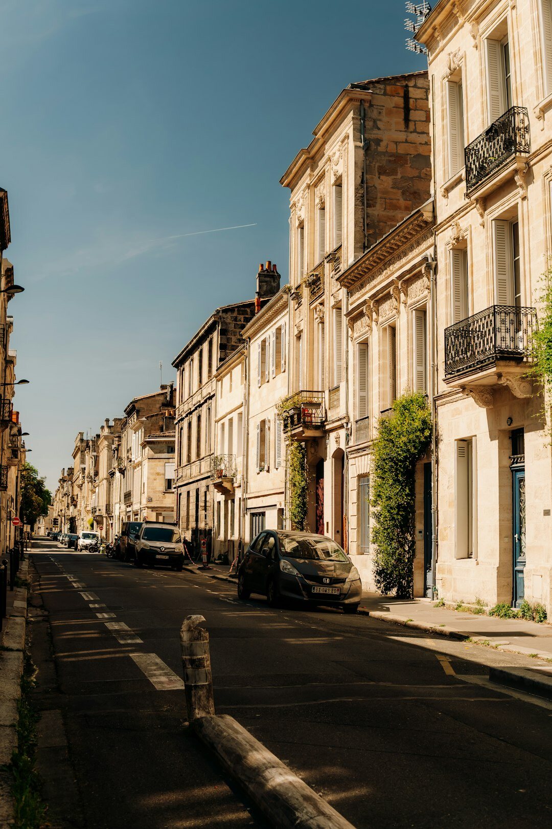 Row of traditional European townhouses on a quiet street